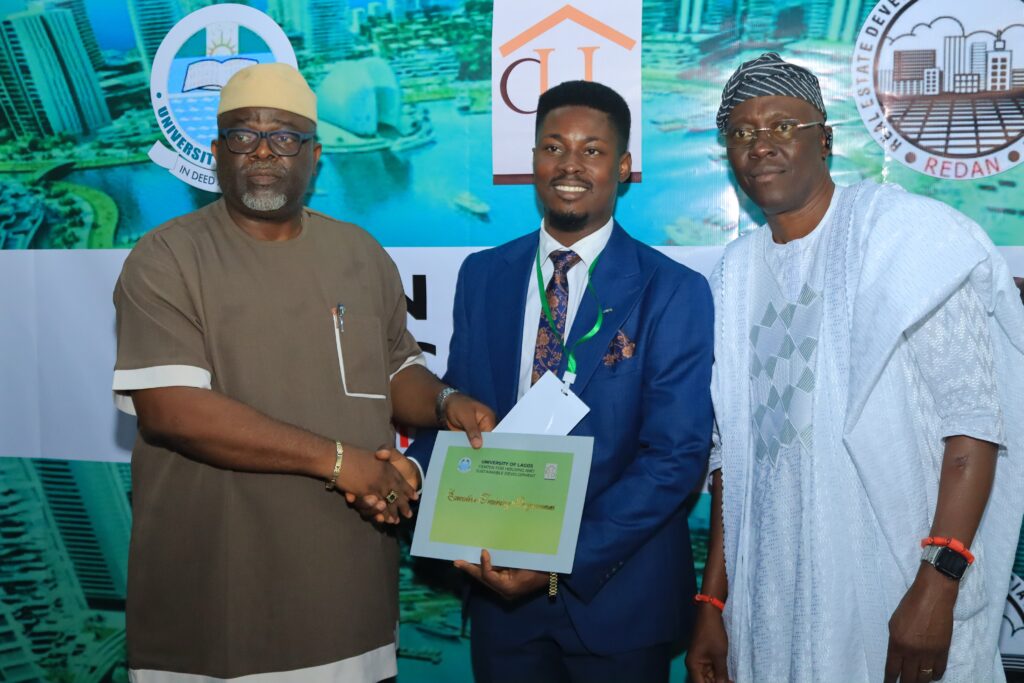 Geofort CEO Emeya Friday holding REDAN Certificate of completion in Lagos, Nigeria
